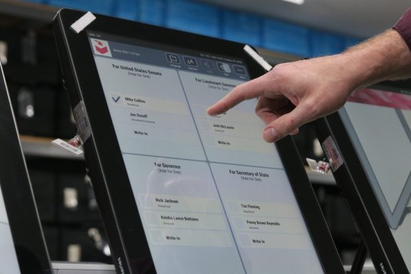 Record-breaking early voting in Georgia, showing diverse voters participating in the democratic process.